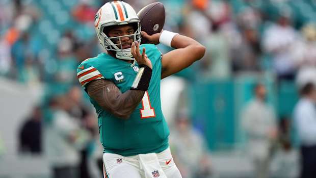 Miami Dolphins quarterback Tua Tagovailoa throws a pass in warmups before a game.